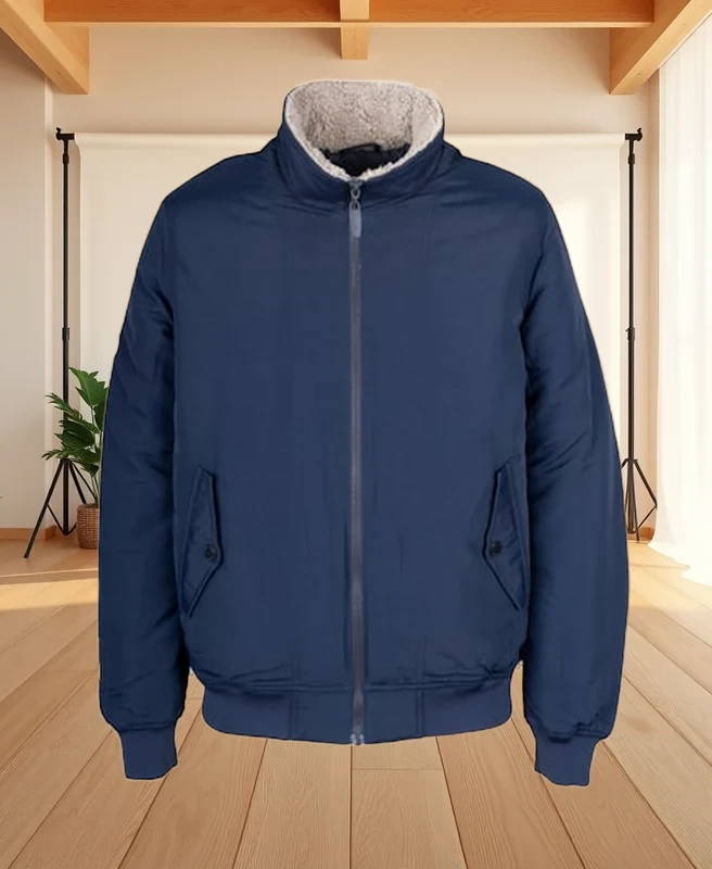 The same navy bomber jacket placed in a warm daylight studio scene